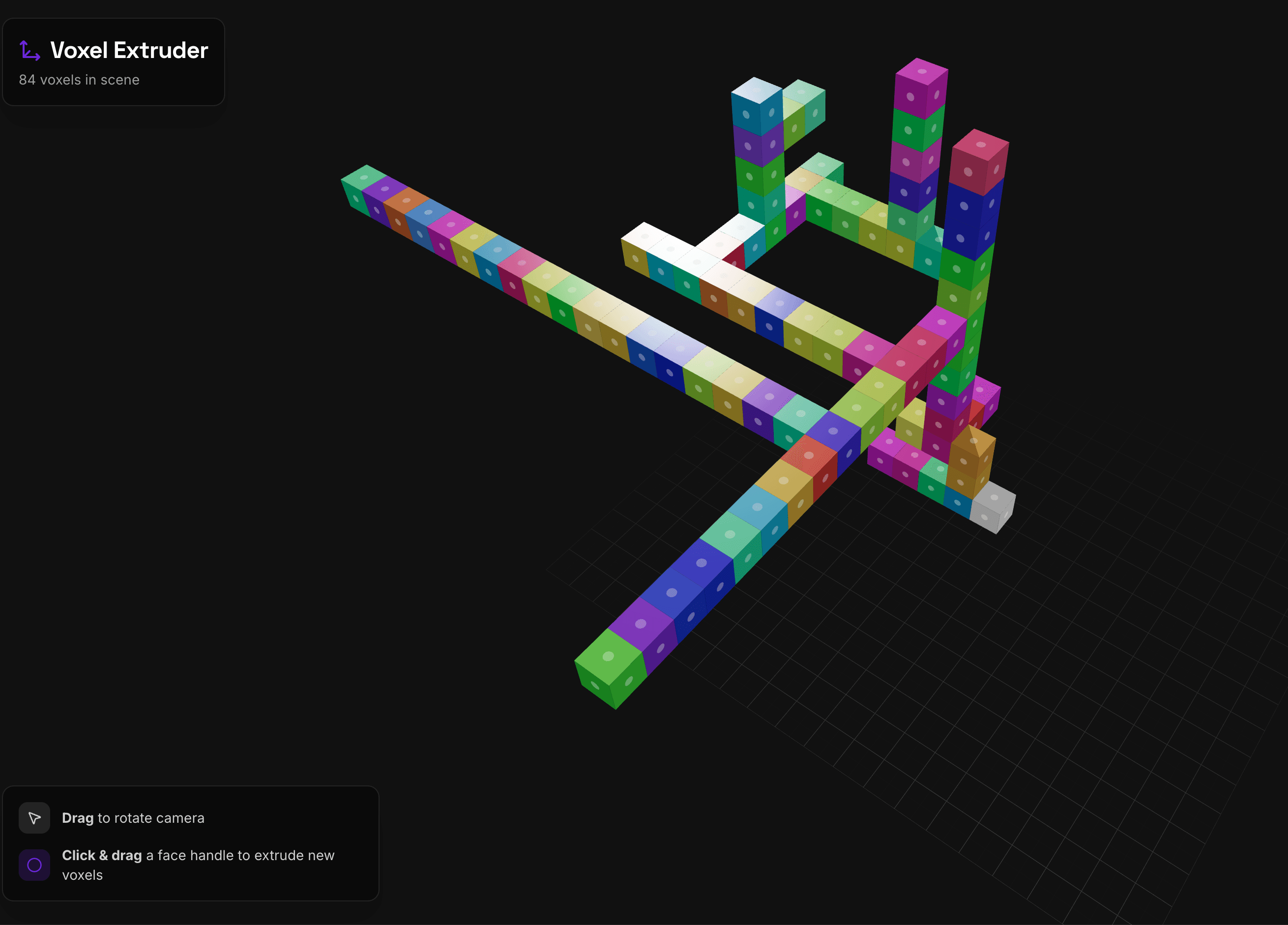 Colorful voxel sculpture and extrusion controls on a dark 3D grid.