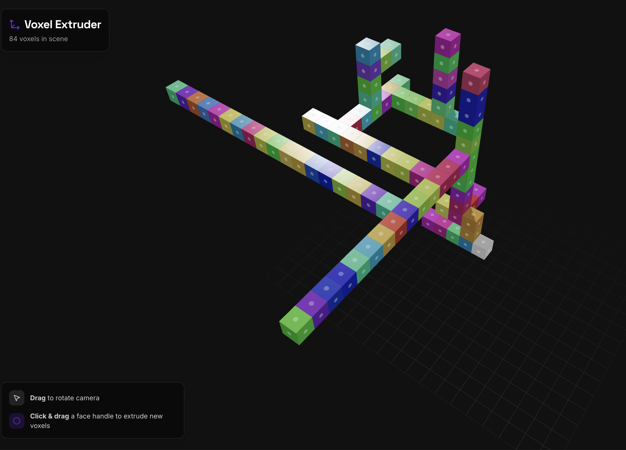 Voxel Extruder - 3D voxel scene with colorful extruded blocks, drag to rotate camera, click and drag face handles to extrude